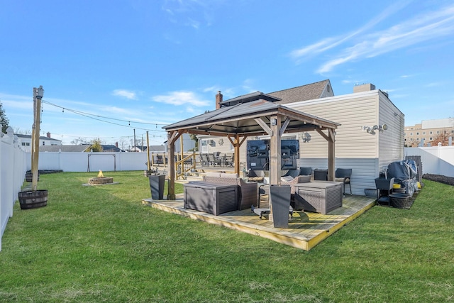 exterior space with an outdoor living space with a fire pit, a fenced backyard, and a gazebo