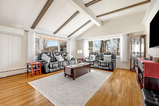 living room featuring light wood-type flooring, a wall unit AC, and a wealth of natural light