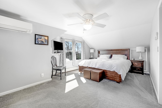 bedroom featuring lofted ceiling, baseboards, carpet flooring, and a wall mounted air conditioner