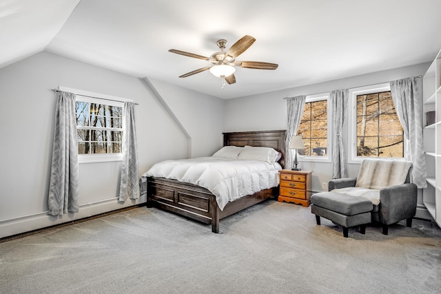 carpeted bedroom with lofted ceiling, baseboard heating, and a ceiling fan