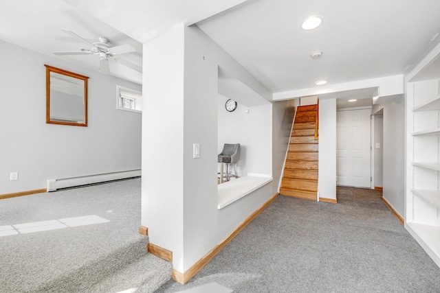 basement with carpet, recessed lighting, a baseboard heating unit, baseboards, and stairs