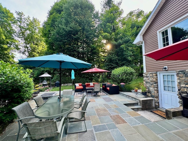 view of patio / terrace featuring outdoor dining space and outdoor lounge area