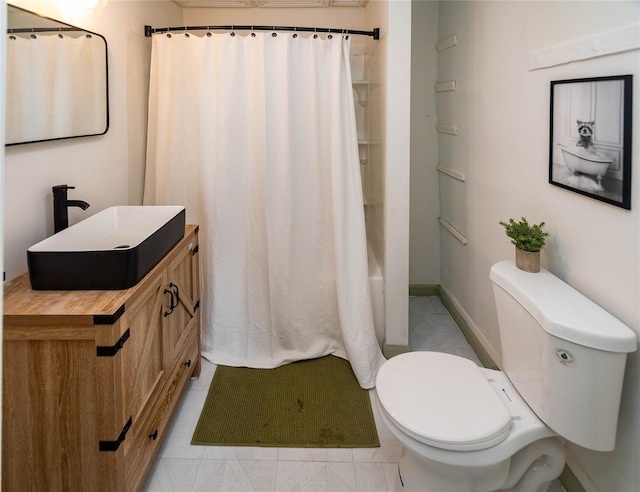 full bathroom with baseboards, toilet, tile patterned floors, shower / bath combination with curtain, and vanity