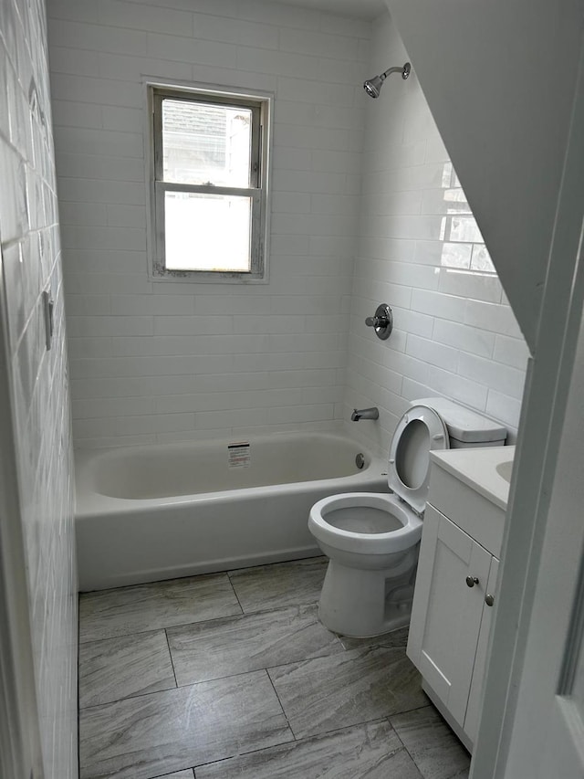 bathroom with shower / tub combination, vanity, and toilet