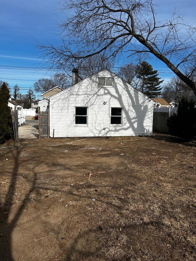 view of outdoor structure featuring fence