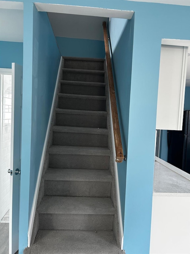 stairs featuring baseboards