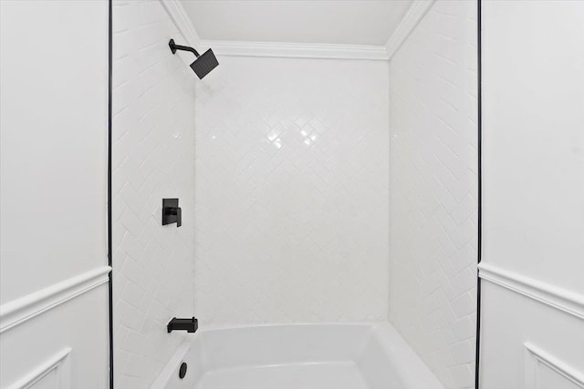 full bath with shower / bathing tub combination, wainscoting, and crown molding