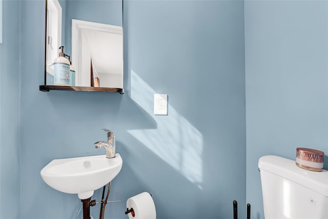 bathroom featuring a sink and toilet