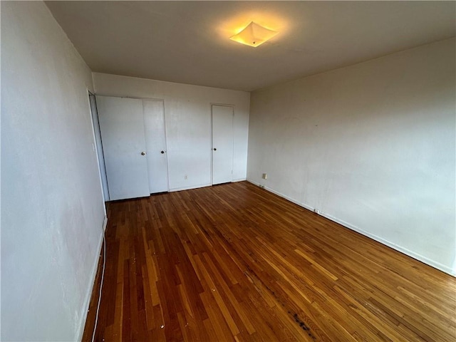 unfurnished bedroom with wood finished floors
