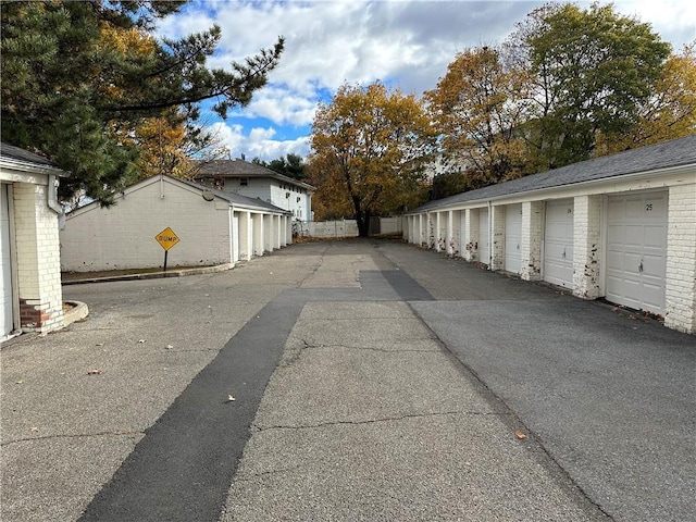 view of road with community garages