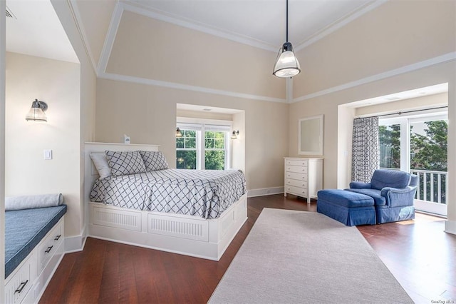 bedroom with access to exterior, dark wood-type flooring, crown molding, and baseboards