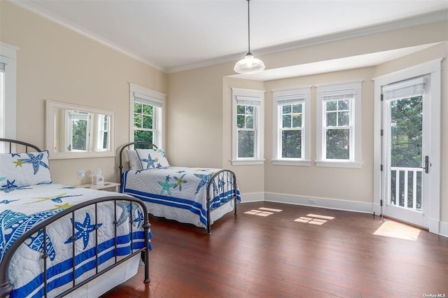 bedroom with crown molding, dark wood-style flooring, baseboards, and access to exterior