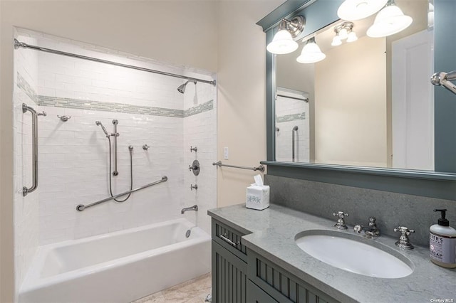 bathroom featuring bathtub / shower combination and vanity