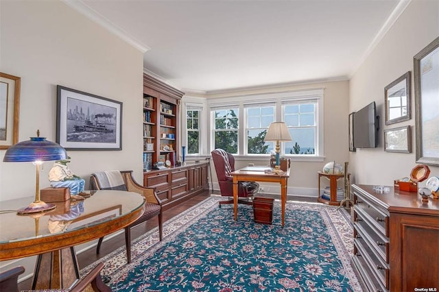 office space with ornamental molding, baseboards, and wood finished floors