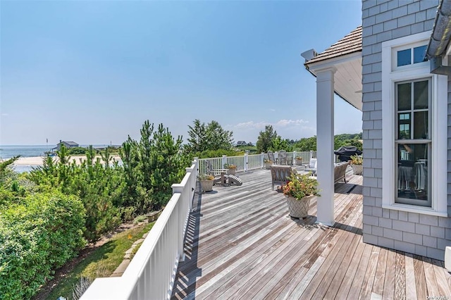 wooden deck with a water view