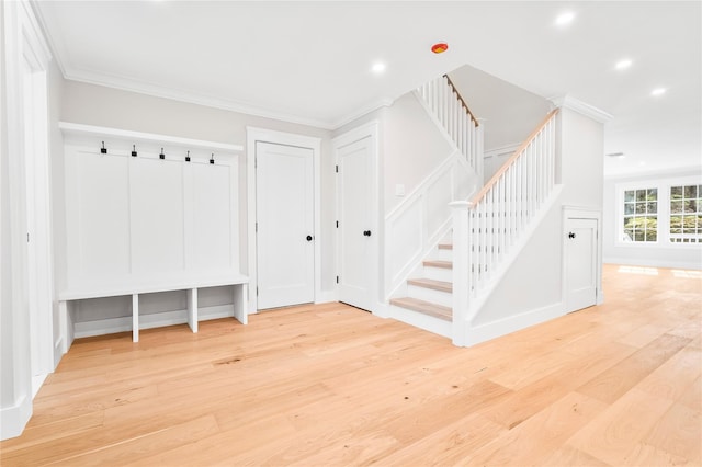 mudroom featuring recessed lighting, crown molding, and wood finished floors