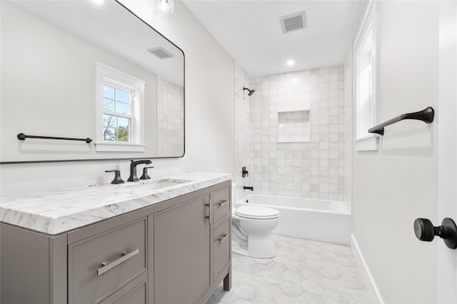 full bathroom featuring shower / tub combination, visible vents, toilet, and vanity