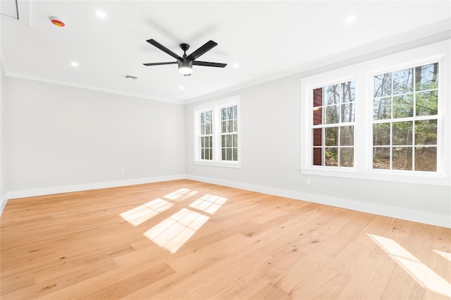 unfurnished room featuring baseboards, a ceiling fan, light wood-style floors, and ornamental molding