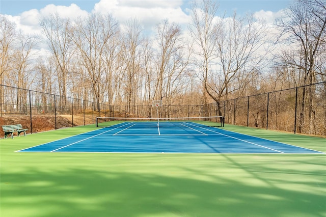 view of sport court featuring community basketball court and fence