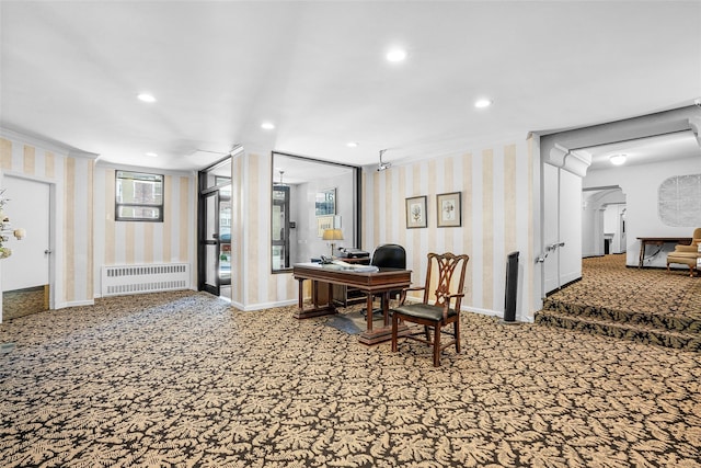 carpeted office with wallpapered walls, baseboards, radiator, crown molding, and recessed lighting