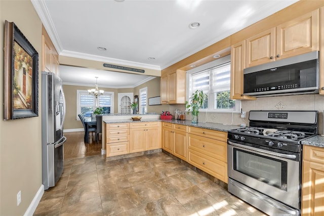 kitchen with stainless steel appliances, a wealth of natural light, a peninsula, and light brown cabinetry