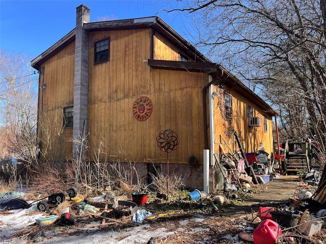 view of side of property featuring a chimney