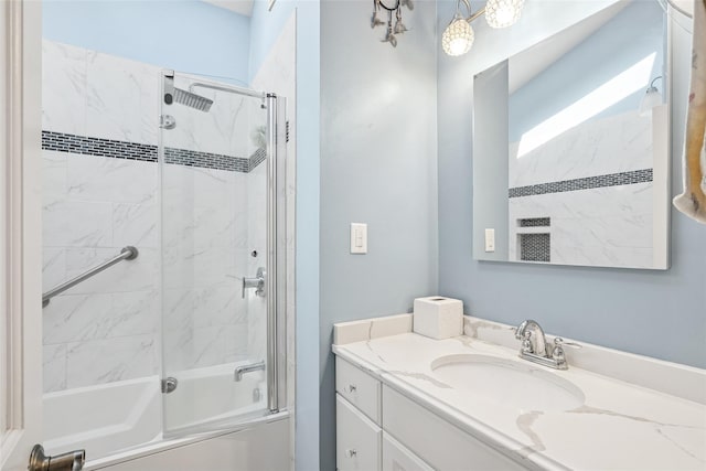 full bathroom with combined bath / shower with glass door and vanity