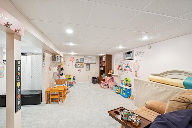 rec room with carpet, a drop ceiling, and recessed lighting