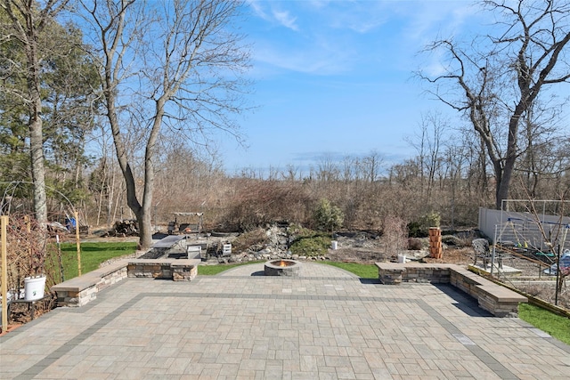 view of patio / terrace with a fire pit