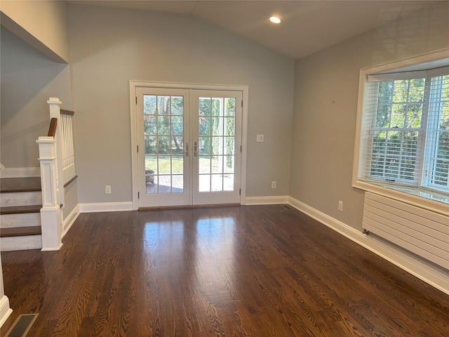 interior space featuring a wealth of natural light, french doors, visible vents, and vaulted ceiling