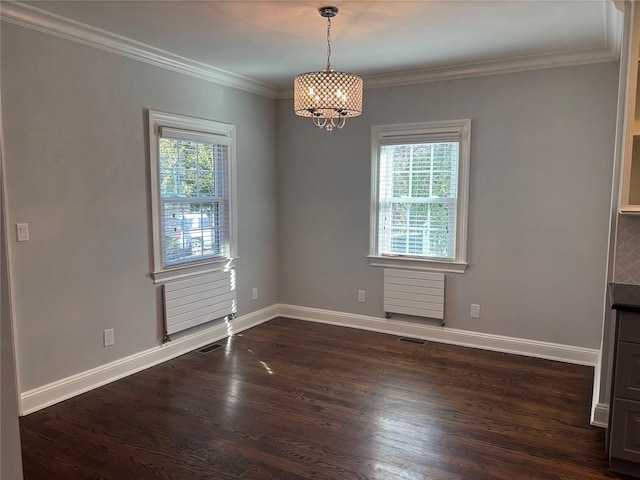 empty room with dark wood-type flooring, ornamental molding, and baseboards