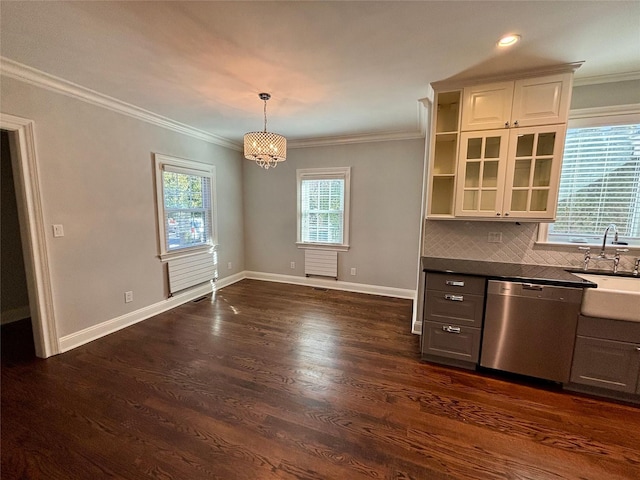 kitchen with crown molding, dark wood-style flooring, a sink, and stainless steel dishwasher