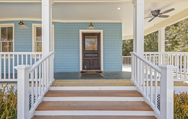 property entrance featuring ceiling fan and a porch