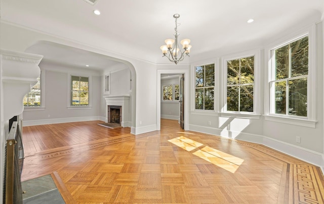 unfurnished living room with a fireplace with flush hearth, baseboards, and recessed lighting