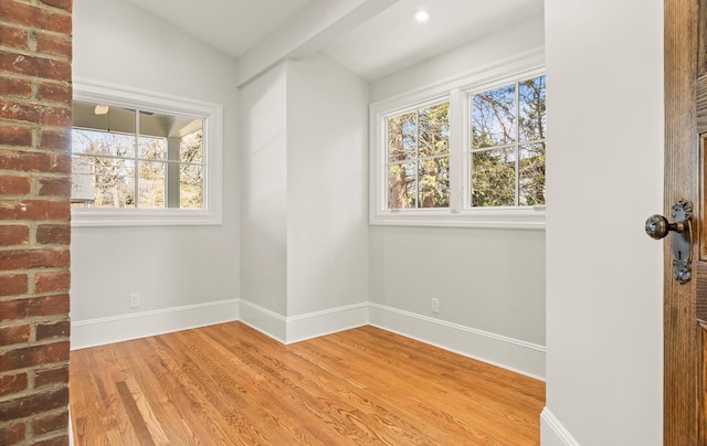 unfurnished room featuring light wood-style flooring, baseboards, and recessed lighting