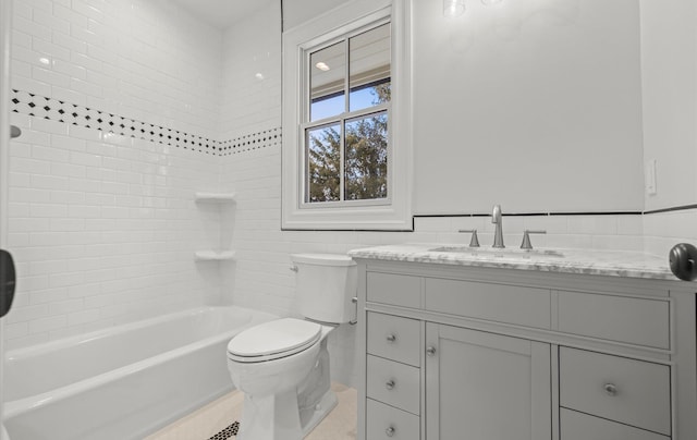 full bathroom with toilet, tub / shower combination, tile walls, and vanity