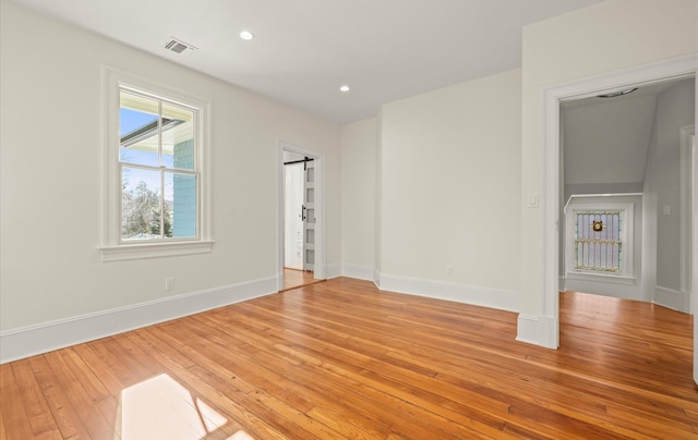 unfurnished bedroom featuring baseboards, recessed lighting, visible vents, and light wood-style floors