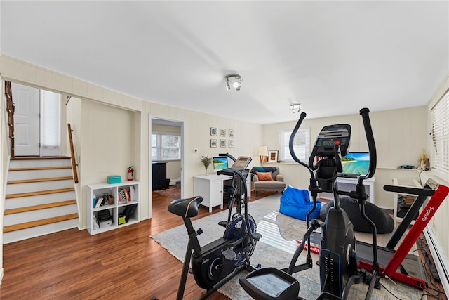 workout area with wood finished floors