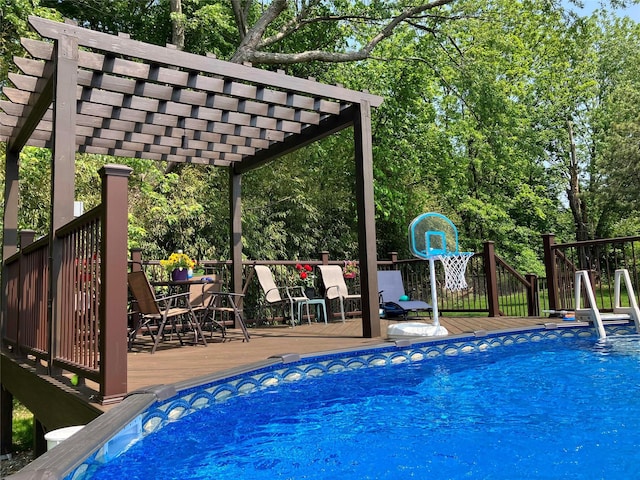 view of swimming pool featuring a fenced in pool, outdoor dining area, a wooden deck, and a pergola