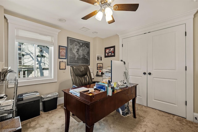 office with light carpet, ceiling fan, visible vents, and baseboards