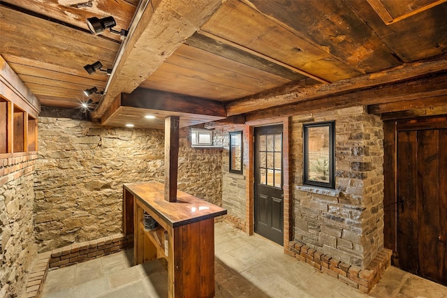 wine room with wooden ceiling and beam ceiling