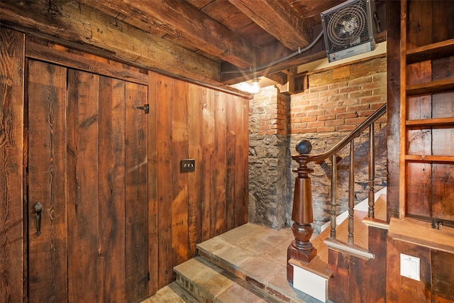 stairway with beam ceiling