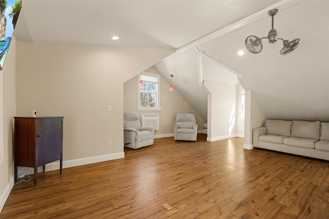 bonus room with lofted ceiling, recessed lighting, wood-type flooring, and baseboards