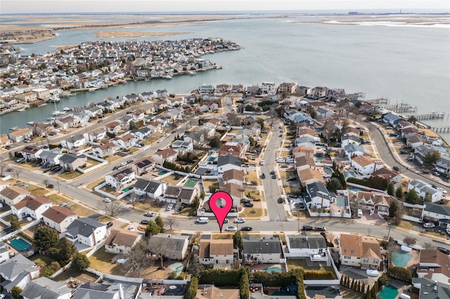 aerial view with a residential view and a water view