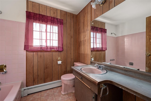 bathroom with toilet, wooden walls, baseboard heating, and vanity