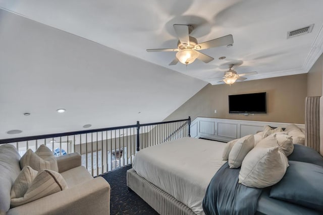 carpeted bedroom with ceiling fan, visible vents, and vaulted ceiling