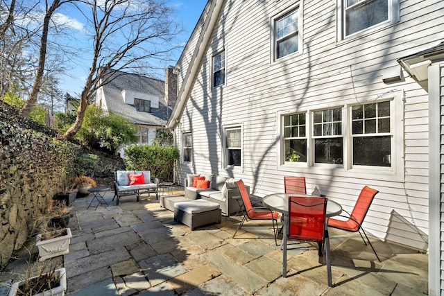 view of patio with an outdoor living space and outdoor dining space