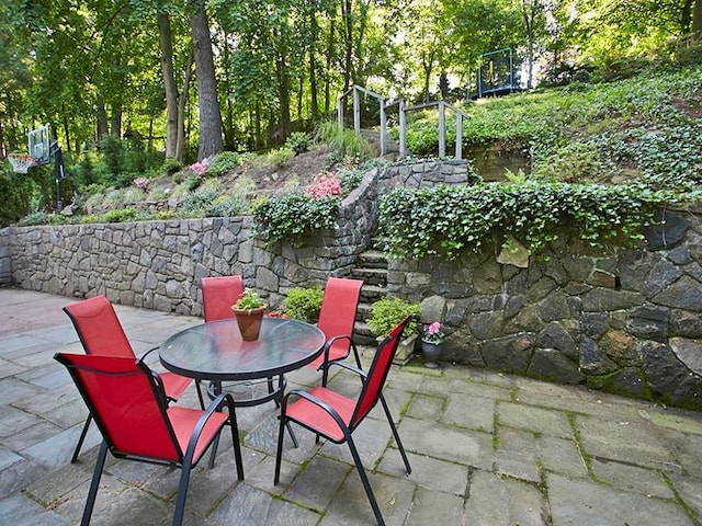 view of patio featuring outdoor dining area