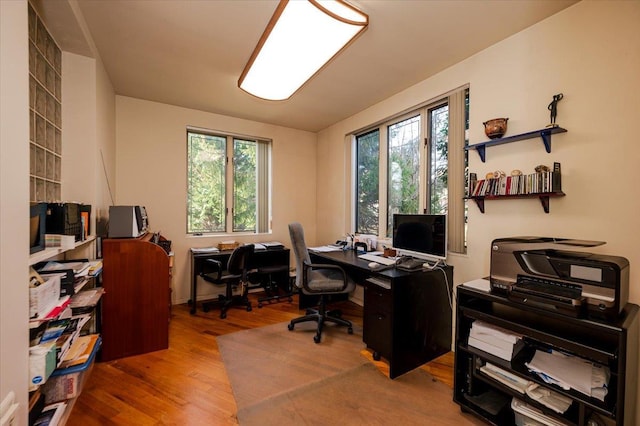 home office with wood finished floors