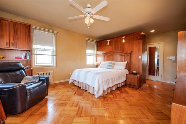 bedroom with radiator and baseboards